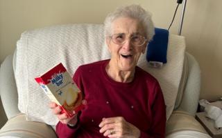 A delighted resident gets an Easter egg gift from Romford shoppers