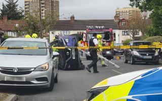 A flipped car in Harold Hill prompted emergency services to rush to the scene